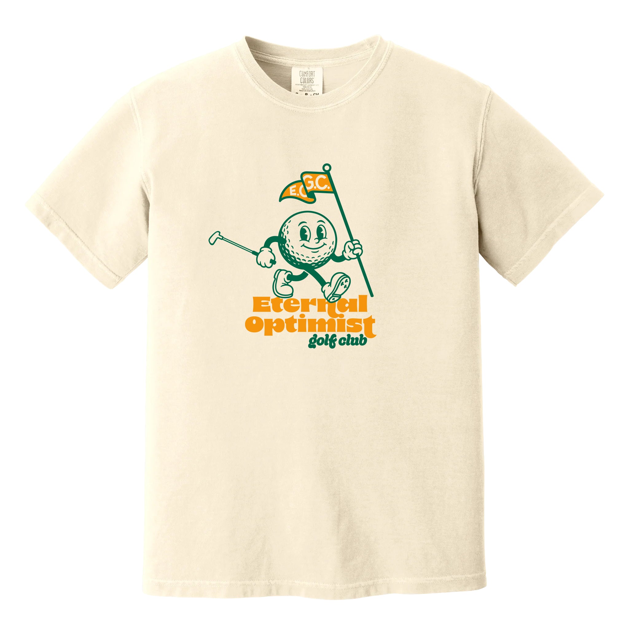 Ivory t-shirt with a 1950s-inspired golf ball cartoon that has legs and arms. He is carrying a putter and a flagstick that has "E.O.G.C." on the flag. Below him are the words 'Eternal Optimist Golf Club'.