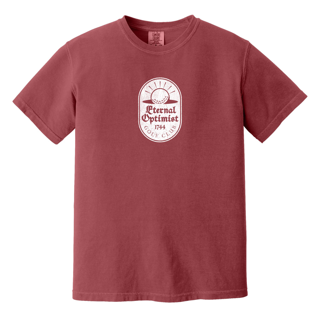 Dark red t-shirt with a white, distressed Eternal Optimist Golf Club logo.