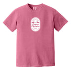 Pink t-shirt with a white, distressed Eternal Optimist Golf Club logo.