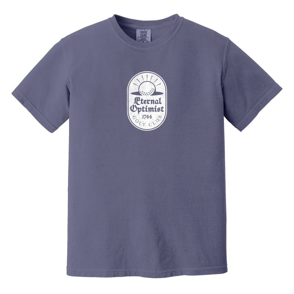 Purple t-shirt with a white, distressed Eternal Optimist Golf Club logo.