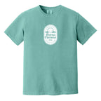 Teal blue t-shirt with a white, distressed Eternal Optimist Golf Club logo.