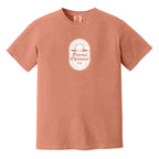 Terracotta t-shirt with a white, distressed Eternal Optimist Golf Club logo.