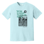 Light blue t-shirt with a vintage photo of Harry Vardon along with an old graphic of the Vardon Flyer golf ball. It also has a quote from Vardon: "Don't play too much golf. Two rounds a day are plenty."