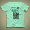 Light green t-shirt with a vintage photo of Harry Vardon along with an old graphic of the Vardon Flyer golf ball. It also has a quote from Vardon: "Don't play too much golf. Two rounds a day are plenty."